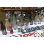 A collection of assorted glass bottles including City Beverages H. Holgate Leeds and J.B. Bowler &