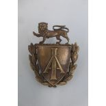 An Imperial Airways cap badge.