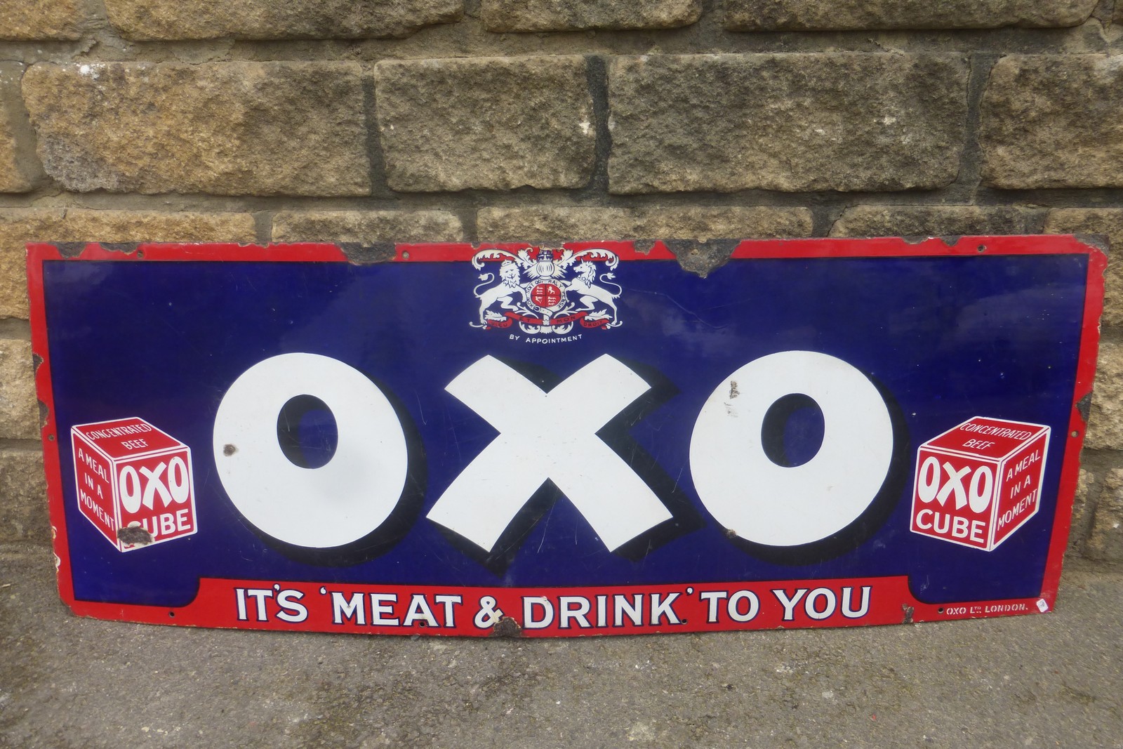 An OXO rectangular enamel sign - "It's meat & drinks to you", 48 x 18".