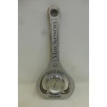 A Mackeson wooden barometer shaped bottle opener, by repute in working order.