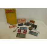 A selection of mixed advertising items including boot studs, a John Bull repair tin and other
