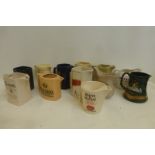 Twelve assorted water jugs all with whisky related advertising on.