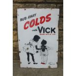 A pictorial rectangular enamel sign advertising Vick vapour-rub depicting two figures in silhouette,