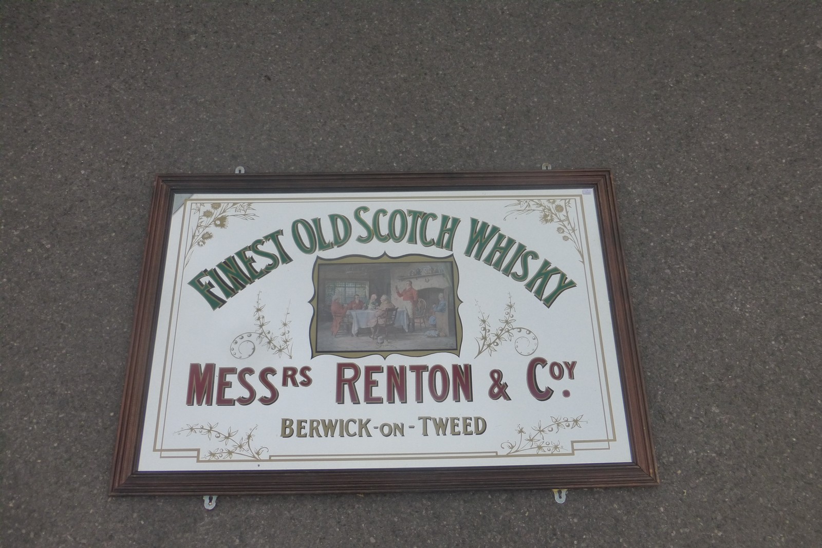 A large reproduction Finest Old Scotch Whisky Messrs Renton & Coy.advertising mirror, 37 1/4 x 24