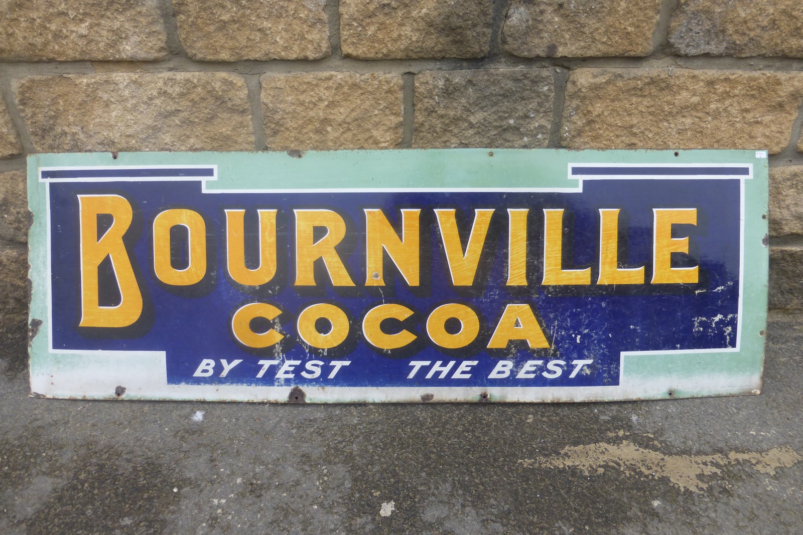 A Bournville Cocoa rectangular enamel sign of unusual colour and design, 48 1/4 x 16".