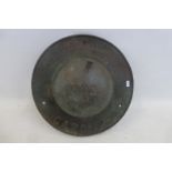A heavy circular insurance plaque, stamped Ross Lyn, Cardiff 1902, 12 1/2" diameter.