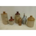 An assortment of stoneware footwarmers (Taylors Hardware Stores, Blackpool, Hatcher & Sons Taunton);