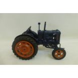 A Chad Valley Fordson Major tractor in dark blue.