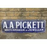 An early rectangular enamel sign advertising A.A. Pickett, watchmaker & Jeweller, by Wyman & Sons