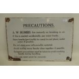 A rectangular enamel sign by Chromo - "Precautions A.W. Bombs fire instantly on breaking in air", 12