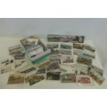 A box of American postcards, many early and of cities including New York.