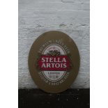 A large Stella Artois Perspex sign.