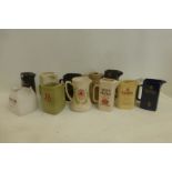 Twelve assorted water jugs all with whisky related advertising on.