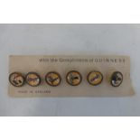 A set of six Guinness buttons/studs, on original card.