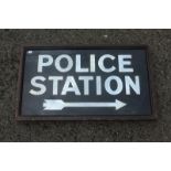 An early rectangular reflective glass sign - "Police Station" with arrow pointing right, set