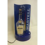 A Martell Cognac illuminated bottle stand.