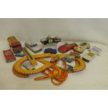 A good box of tinplate models including a Japanese friction powered bubble car, a Citroen DS etc.;