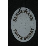 A small oval Sandeman's Port & Sherry advertising mirror.