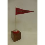 A Meccano tin advertising pennant flag on stand.