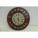 A 'St. Raphael Quinqine' circular tinplate wall clock from a French bar/cafe, 19" diameter.