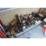 A large quantity of tools, flat irons and packaging relating to an early ironmongers.