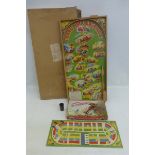 A Grand Prix Bagatelle game and a boxed 'Speedway' race game, from the Harlesden Series.