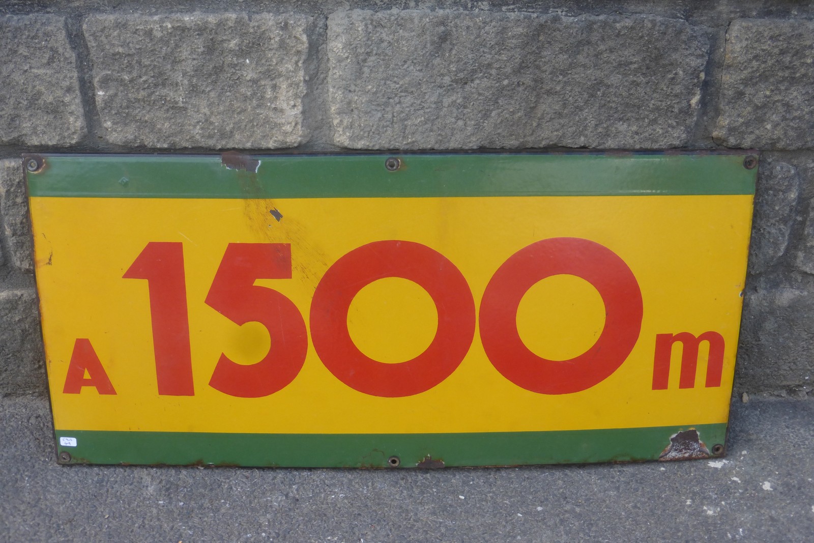 A rectangular enamel distance sign "1500m", 29 1/2 x 13 3/4".