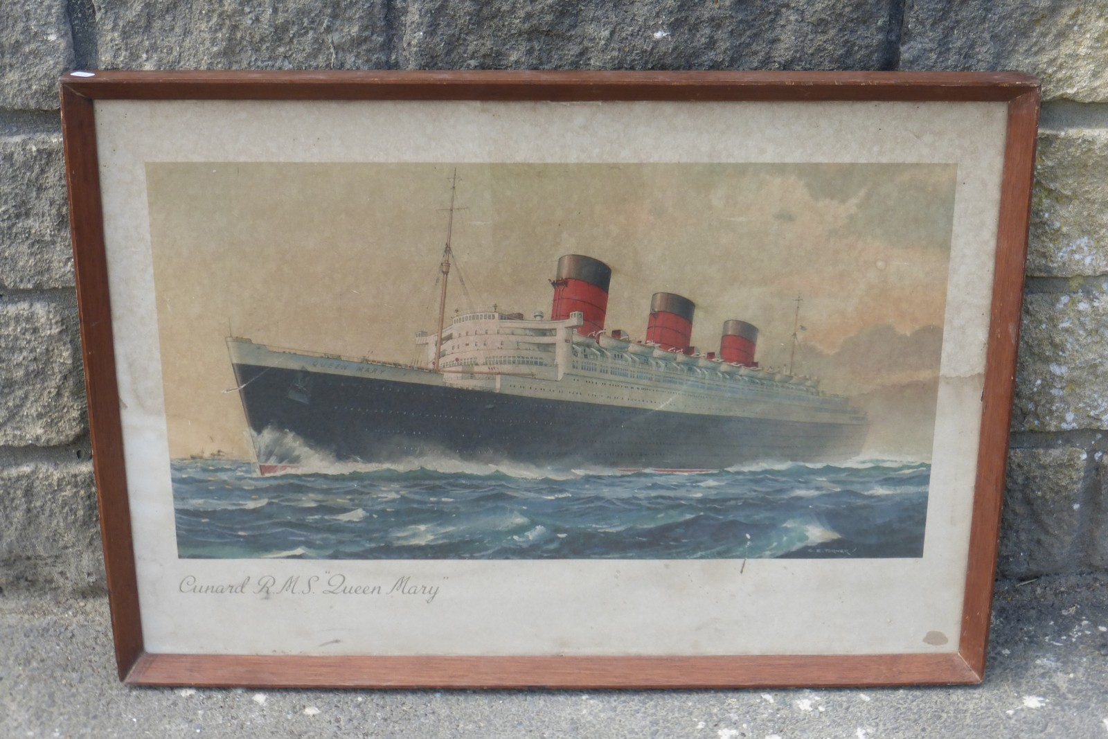 AFTER C.E. TURNER - a framed and glazed print of the Cunard R.M.S. "Queen Mary", 29 1/2 x 21".