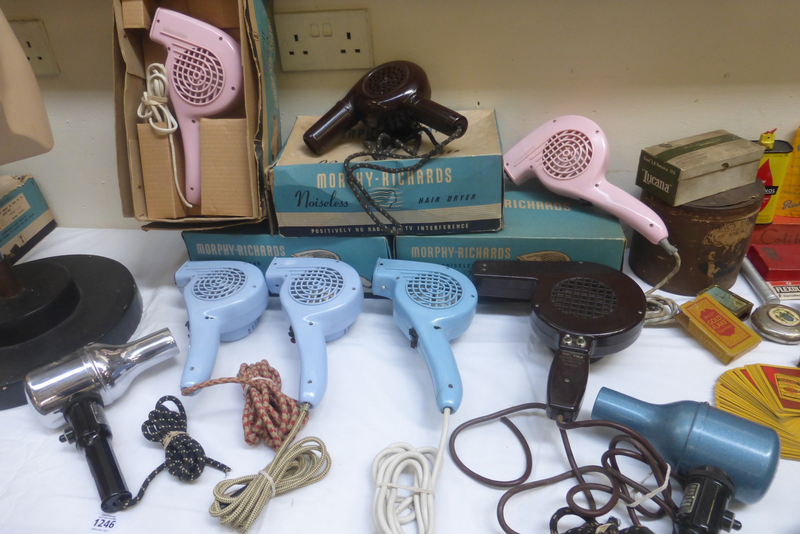 A collection of early plastic hairdryers, mostly blue and pink, some boxed, Morphy Richards, one