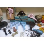 A collection of early plastic hairdryers, mostly blue and pink, some boxed, Morphy Richards, one