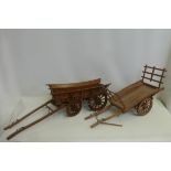 Two large good quality wooden and brass mounted scale model farm carts.