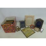 A box of assorted photograph frames including one silver.