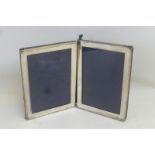 A silver double photograph frame, maker A & J. Zimmerman Birmingham 1908.