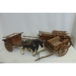 Three large good quality wooden and brass mounted scale model farm carts.