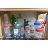 A collection of glass dispensing jars, glass bottles etc.