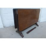 A 19th Century mahogany drop flap sutherland table raised upon fluted supports.