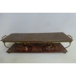 An Arts and Crafts hammered copper and brass rectangular hot plate with maker's mark.