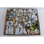 A tray of assorted 19th Century and later ceramics including crestedware, Wade etc.
