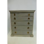 A painted chest/collector's cabinet of small proportions with five graduated drawers.