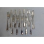 Twelve silver table forks, some Georgian.