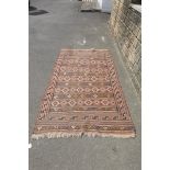 A machine made rug with all over geometric designs 49 x 92".