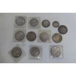 A box of silver coins including four crowns, 1889, two examples of 1890 and 1899, also two 1890 d/