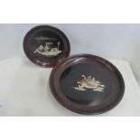 A Japanese chinoisserie lacquered shibayama circular wall plaque, the scene of figures in a boat