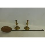 A pair of 18th Century seamed brass candlesticks on circular bases, together with an 18th Century