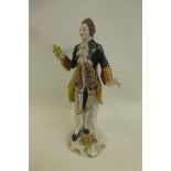 A Dresden figure of a 17th Century classically dressed gentleman.