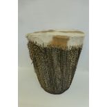 A native African skin covered drum of large proportions.