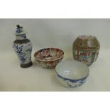 An assortment of 19th Century Chinese and Japanese ceramics including a Canton famille rose lidded