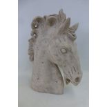 A decorative sculpture of a horse's head.