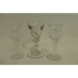 An 18th Century drinking glass and two unusual drinking glasses.