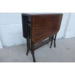 An Edwardian inlaid mahogany sutherland table.